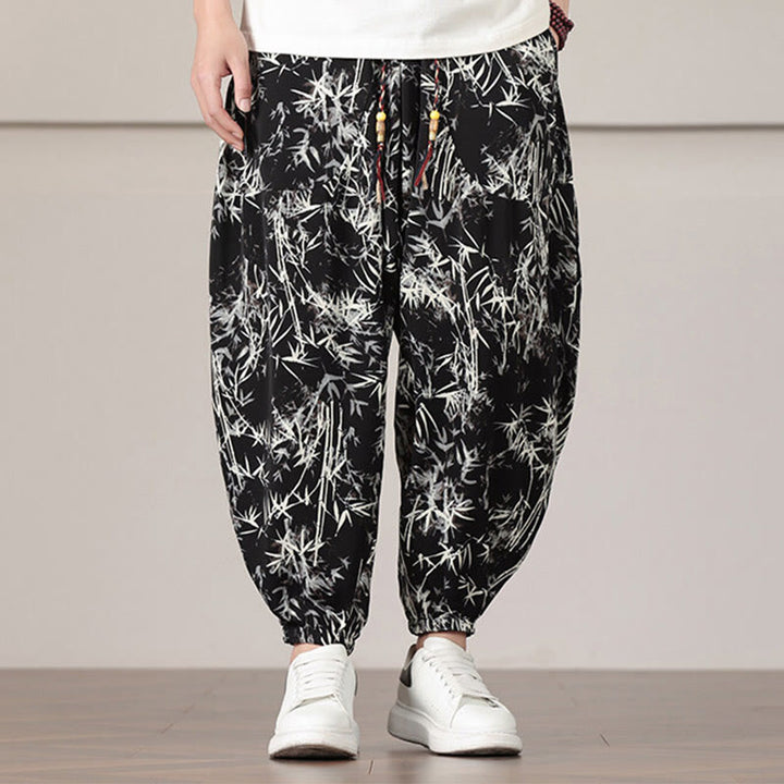 Pantalones harén con cordón y bolsillos para hombre con estampado de hojas de bambú y Buddha Stones