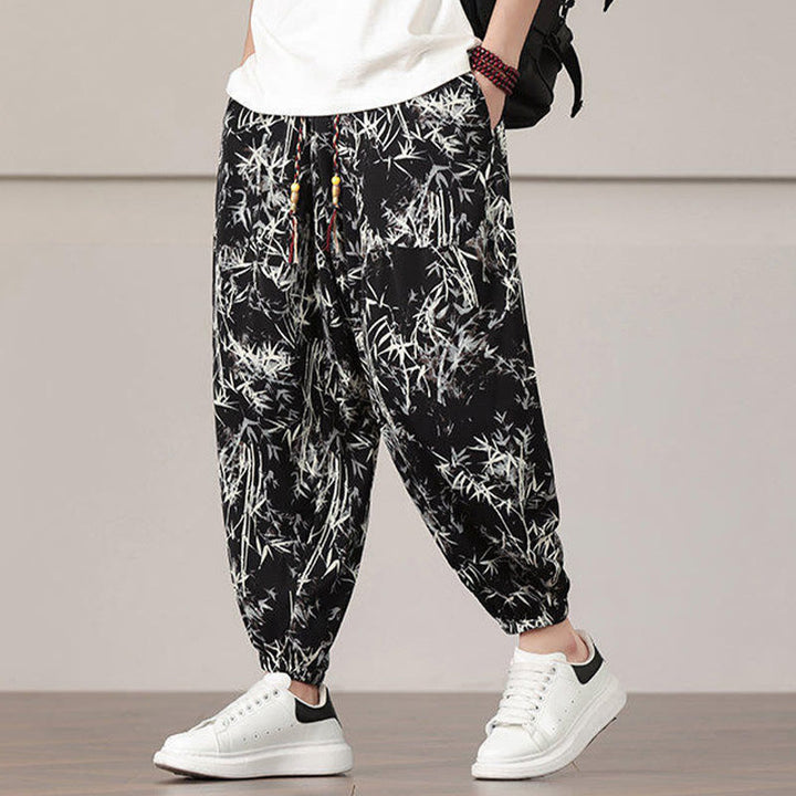 Pantalones harén con cordón y bolsillos para hombre con estampado de hojas de bambú y Buddha Stones