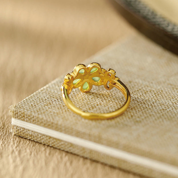 Anillo de prosperidad ajustable con flor de oro bañado en plata de ley 925 y jade hetiano natural de Buddha Stones