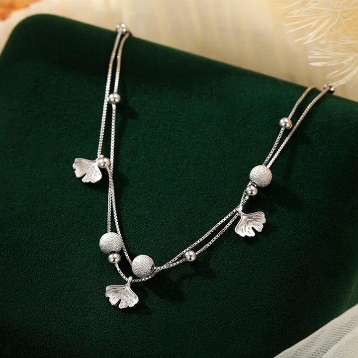 Tobillera con protección de doble capa y hojas de ginkgo en plata de ley 925 con Buddha Stones