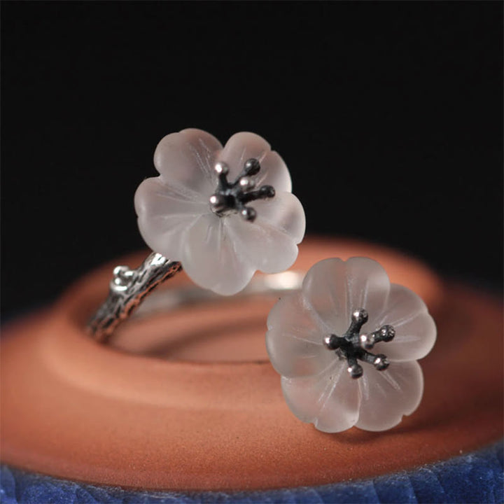 Anillo de protección ajustable con doble flor de ciruelo y cristales blancos de plata de ley 925 de Buddha Stones