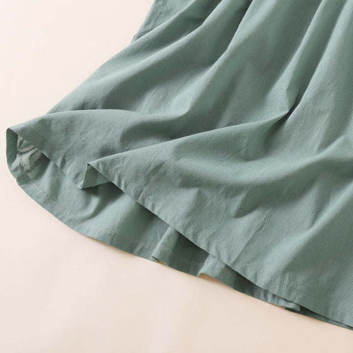 Vestido midi de lino y algodón de manga corta con diseño de botones de verano y bolsillos de Buddha Stones