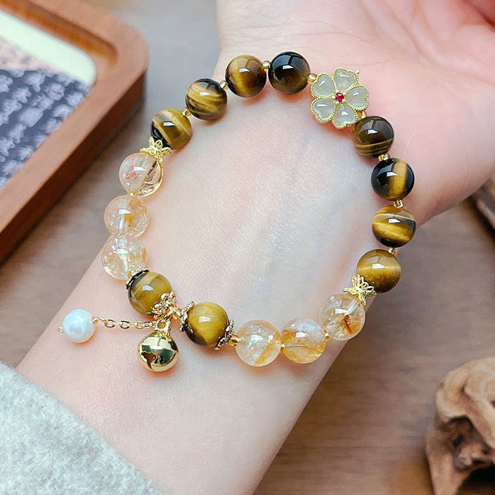 Pulsera de coraje con campana de flores y cuentas de citrino y ojo de tigre natural de Buddha Stones