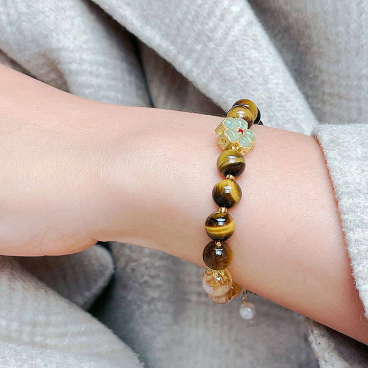 Pulsera de coraje con campana de flores y cuentas de citrino y ojo de tigre natural de Buddha Stones