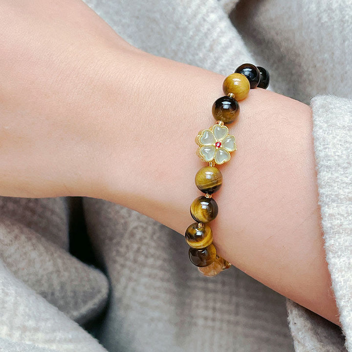 Pulsera de coraje con campana de flores y cuentas de citrino y ojo de tigre natural de Buddha Stones