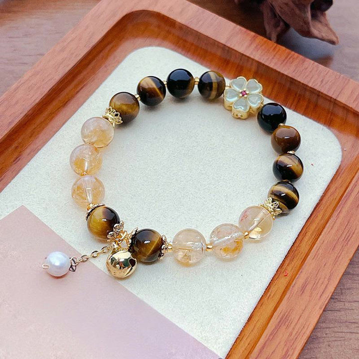 Pulsera de coraje con campana de flores y cuentas de citrino y ojo de tigre natural de Buddha Stones