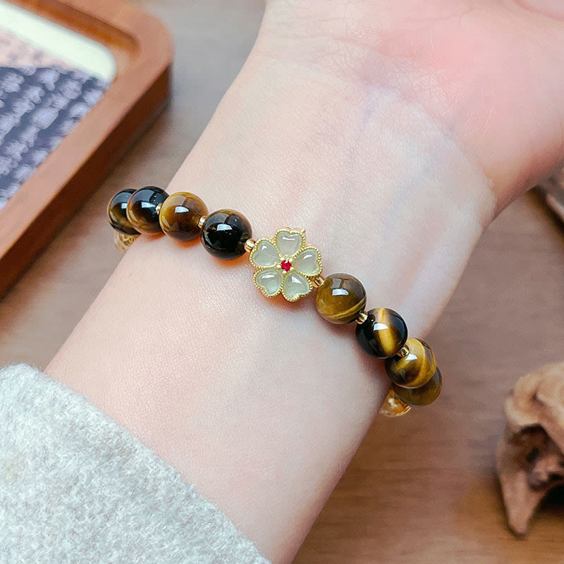 Pulsera de coraje con campana de flores y cuentas de citrino y ojo de tigre natural de Buddha Stones