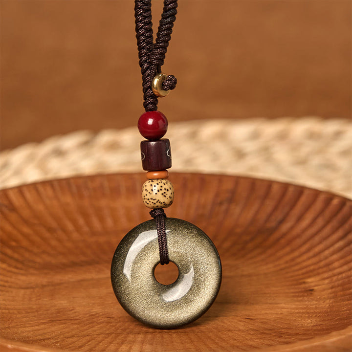 Llavero reforzado con hebilla de paz de obsidiana con brillo dorado natural y Buddha Stones