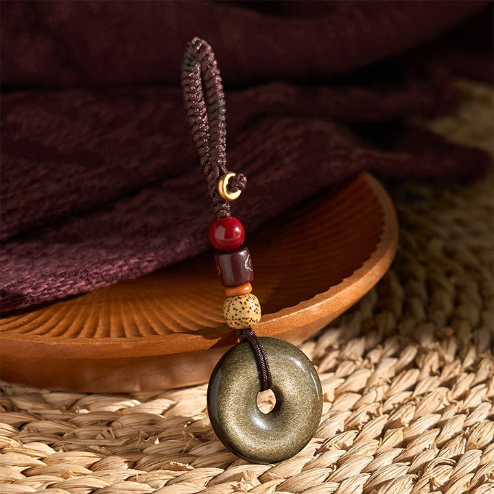 Llavero reforzado con hebilla de paz de obsidiana con brillo dorado natural y Buddha Stones