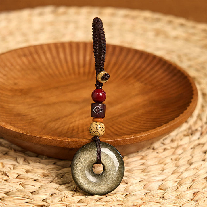 Llavero reforzado con hebilla de paz de obsidiana con brillo dorado natural y Buddha Stones
