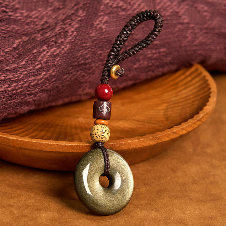 Llavero reforzado con hebilla de paz de obsidiana con brillo dorado natural y Buddha Stones