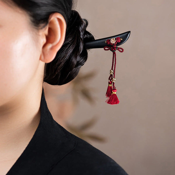 Horquilla protectora con borlas de nudo chino de hilo rojo y ébano con Buddha Stones