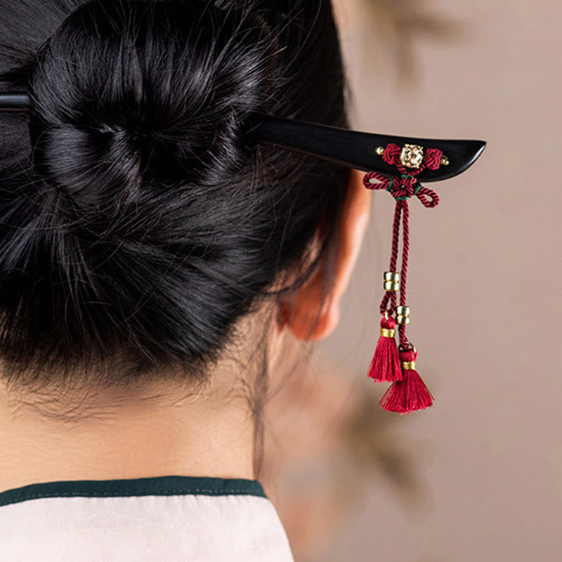 Horquilla protectora con borlas de nudo chino de hilo rojo y ébano con Buddha Stones