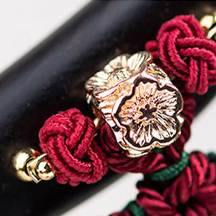 Horquilla protectora con borlas de nudo chino de hilo rojo y ébano con Buddha Stones
