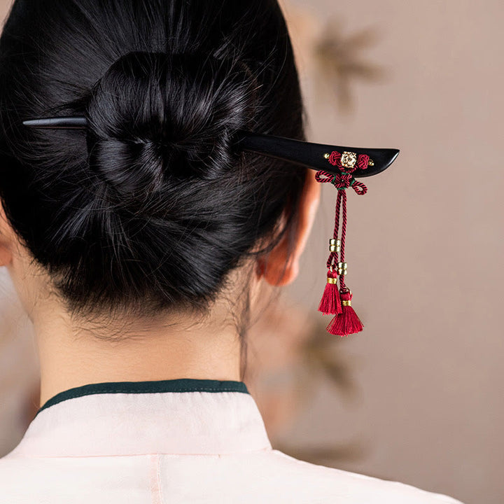 Horquilla protectora con borlas de nudo chino de hilo rojo y ébano con Buddha Stones