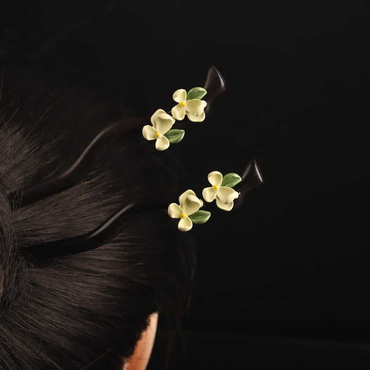 Horquilla con Buddha Stones, ébano, pétalos de gardenia y coraje