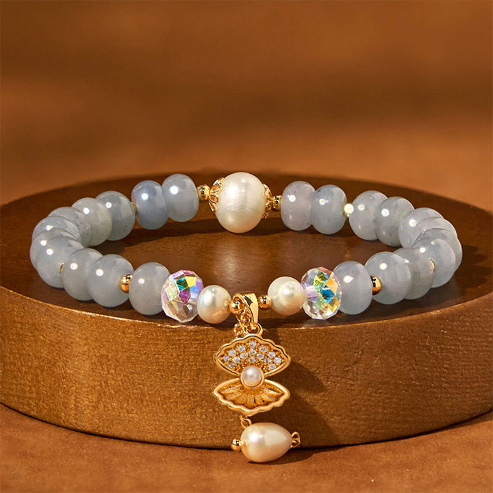 Pulsera de cuentas curativas de concha de perla y aguamarina natural de Buddha Stones
