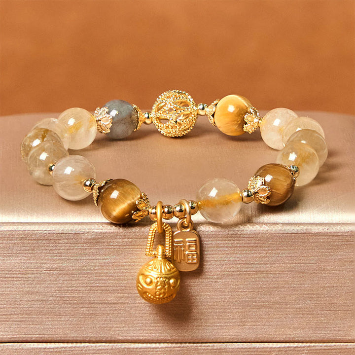 Pulsera de la buena fortuna con Buddha Stones de cuarzo rutilado natural con carácter Fu de metal que traga bestias