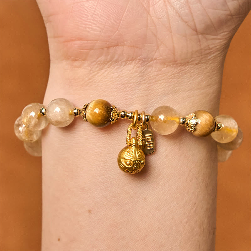 Pulsera de la buena fortuna con Buddha Stones de cuarzo rutilado natural con carácter Fu de metal que traga bestias