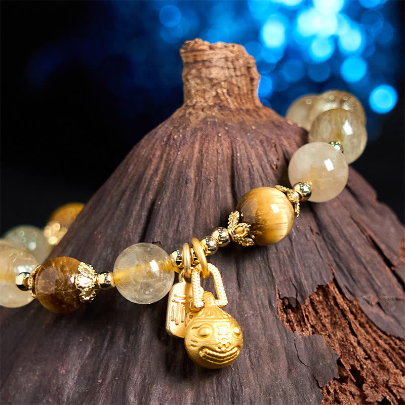 Pulsera de la buena fortuna con Buddha Stones de cuarzo rutilado natural con carácter Fu de metal que traga bestias