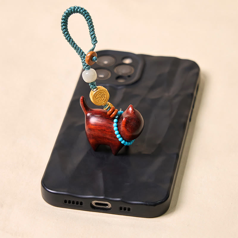 Llavero con el símbolo de la abundancia Fu de Buddha Stones , jade hetiano, sándalo natural, sándalo rojo, sándalo verde y sándalo rojo.