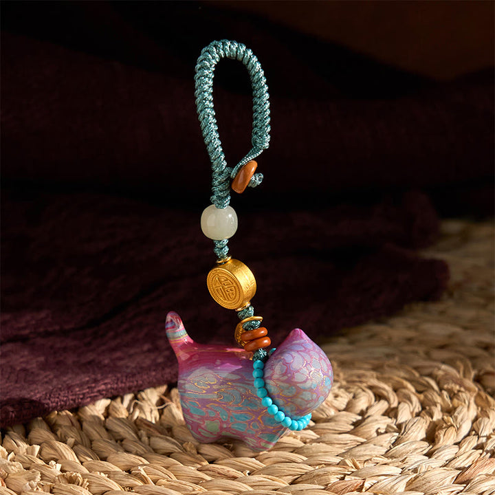 Llavero con el símbolo de la abundancia Fu de Buddha Stones , jade hetiano, sándalo natural, sándalo rojo, sándalo verde y sándalo rojo.