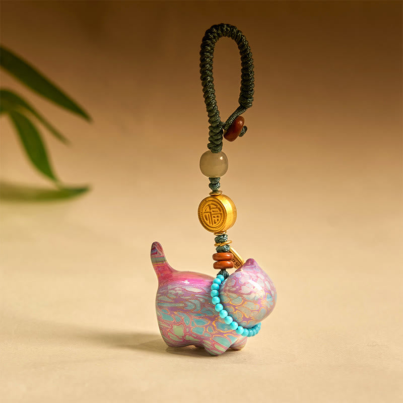 Llavero con el símbolo de la abundancia Fu de Buddha Stones , jade hetiano, sándalo natural, sándalo rojo, sándalo verde y sándalo rojo.