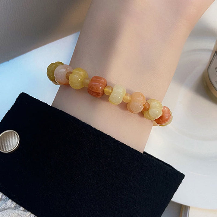 Pulsera de cuentas de calabaza de jade y seda dorada con Buddha Stones para la riqueza y la suerte