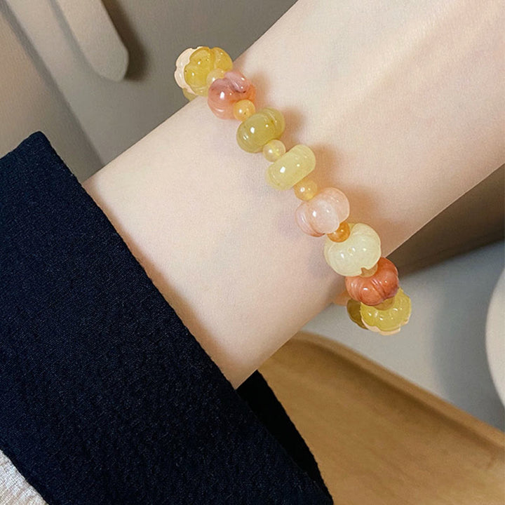 Pulsera de cuentas de calabaza de jade y seda dorada con Buddha Stones para la riqueza y la suerte