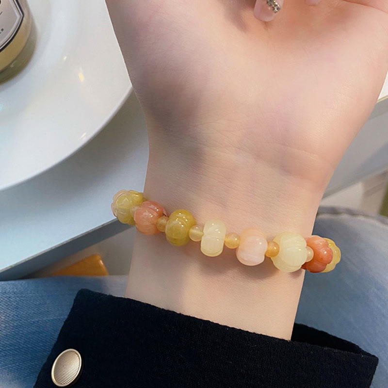 Pulsera de cuentas de calabaza de jade y seda dorada con Buddha Stones para la riqueza y la suerte