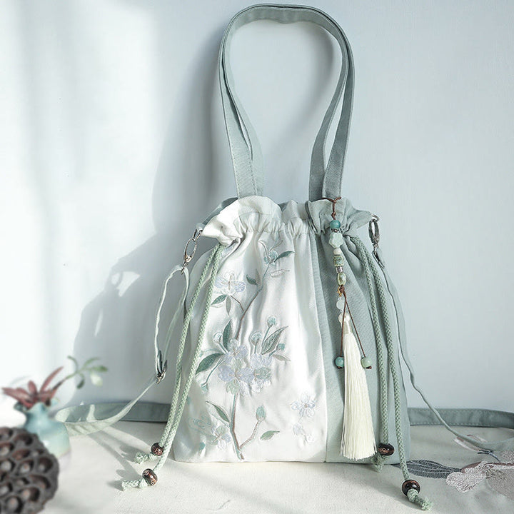 Bolso bandolera de lona con bordado de Buddha Stones, verde pera y epifilo azul.