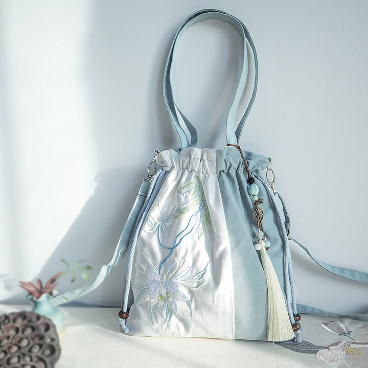 Bolso bandolera de lona con bordado de Buddha Stones, verde pera y epifilo azul.