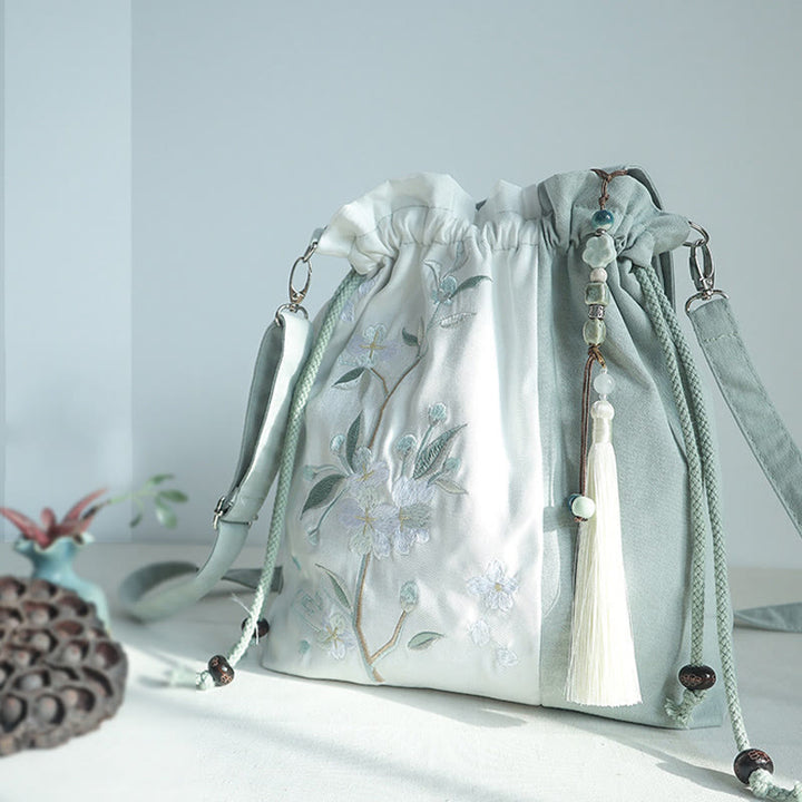 Bolso bandolera de lona con bordado de Buddha Stones, verde pera y epifilo azul.