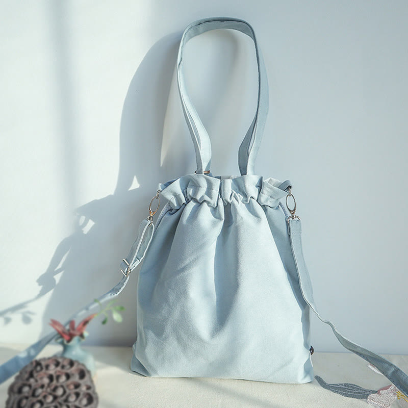 Bolso bandolera de lona con bordado de Buddha Stones, verde pera y epifilo azul.