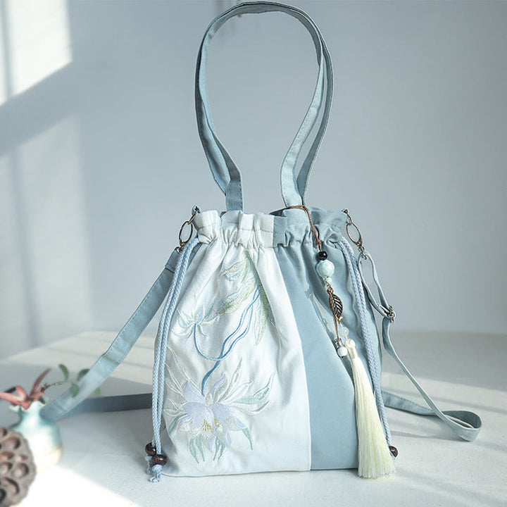 Bolso bandolera de lona con bordado de Buddha Stones, verde pera y epifilo azul.