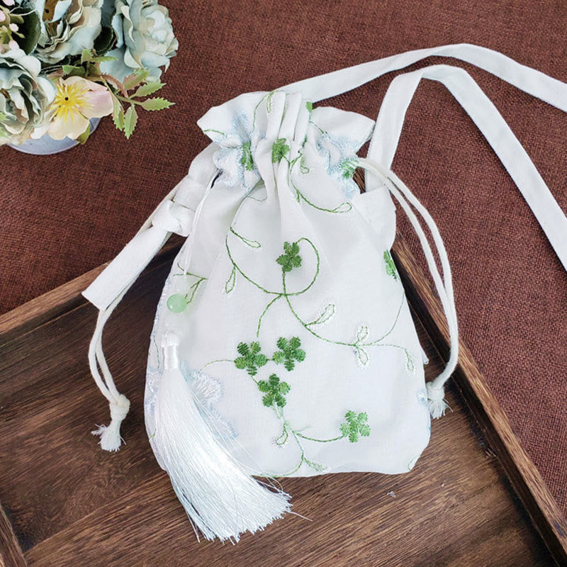 Bolso bandolera de lona con Buddha Stones , flores bordadas y flores de cerezo enredaderas.