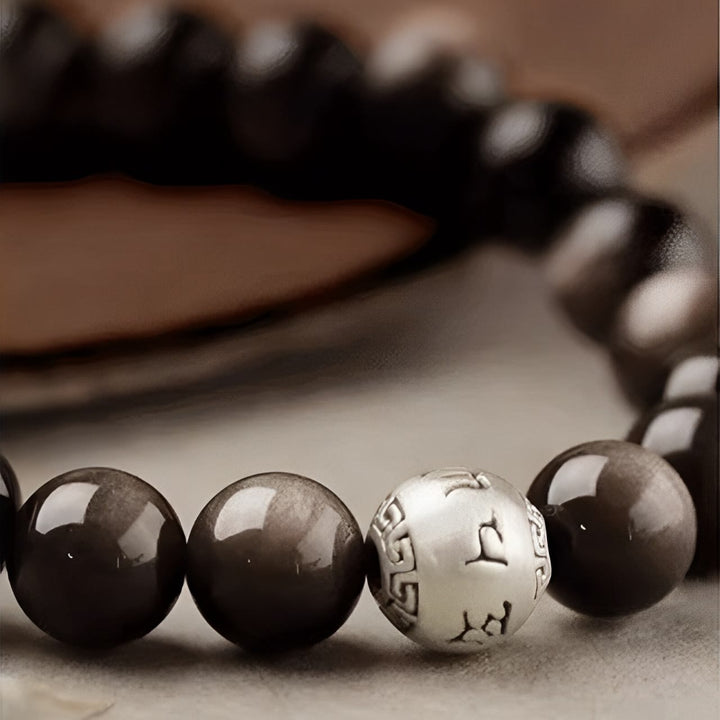 Pulsera de obsidiana con Buddha Stones y brillo plateado natural, protección Om Mani Padme Hum
