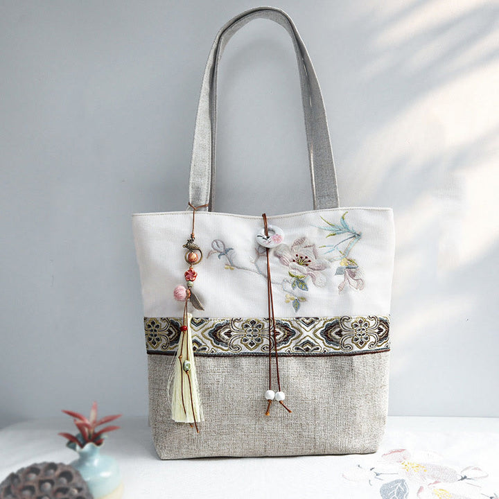 Bolso de hombro de lona y poliéster con bordado de magnolia y Buddha Stones