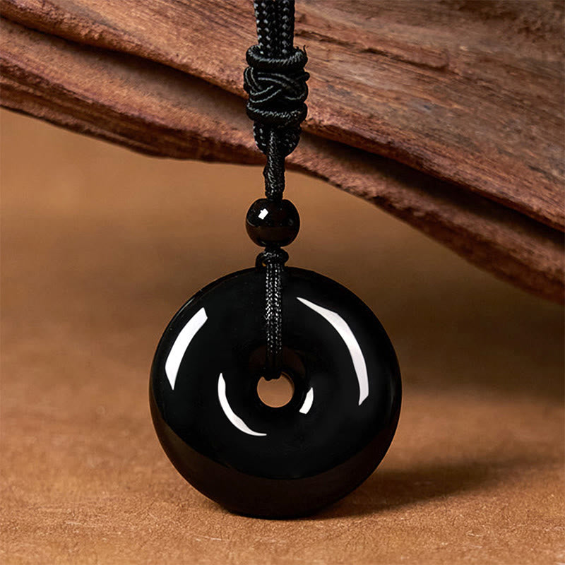 Collar con colgante de cuerda de fuerza con hebilla de paz y obsidiana negra natural de Buddha Stones