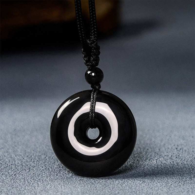 Collar con colgante de cuerda de fuerza con hebilla de paz y obsidiana negra natural de Buddha Stones