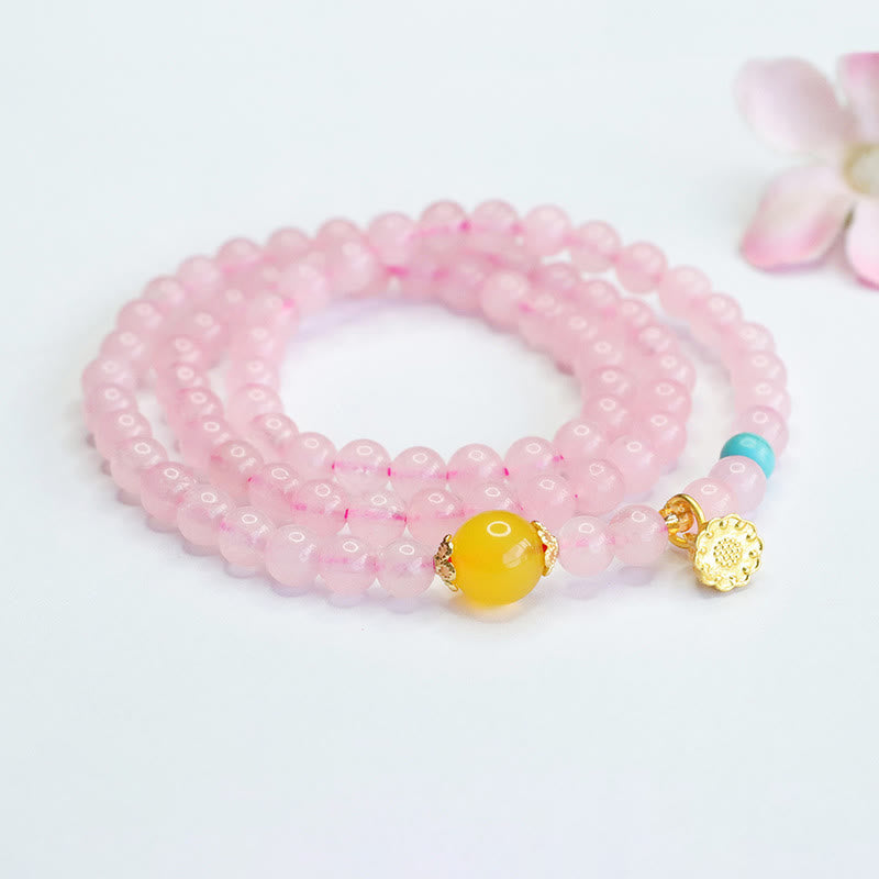 Pulsera de loto con cristales rosas y múltiples círculos de calcedonia amarilla y calidez de Buddha Stones