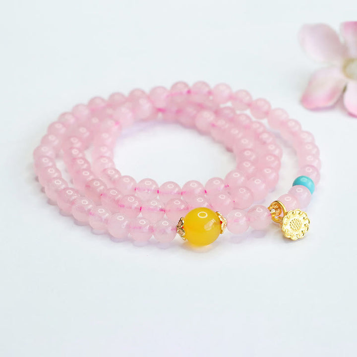 Pulsera de loto con cristales rosas y múltiples círculos de calcedonia amarilla y calidez de Buddha Stones