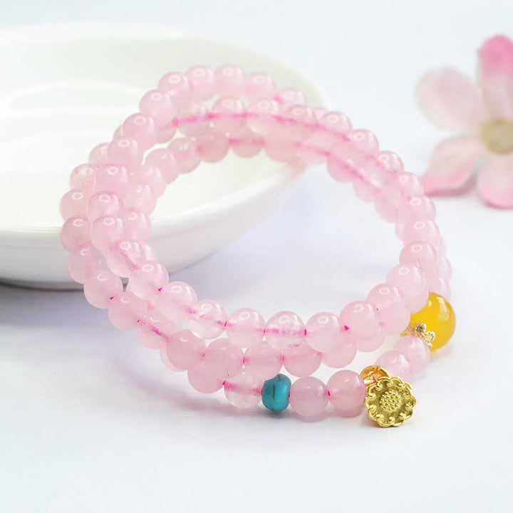 Pulsera de loto con cristales rosas y múltiples círculos de calcedonia amarilla y calidez de Buddha Stones