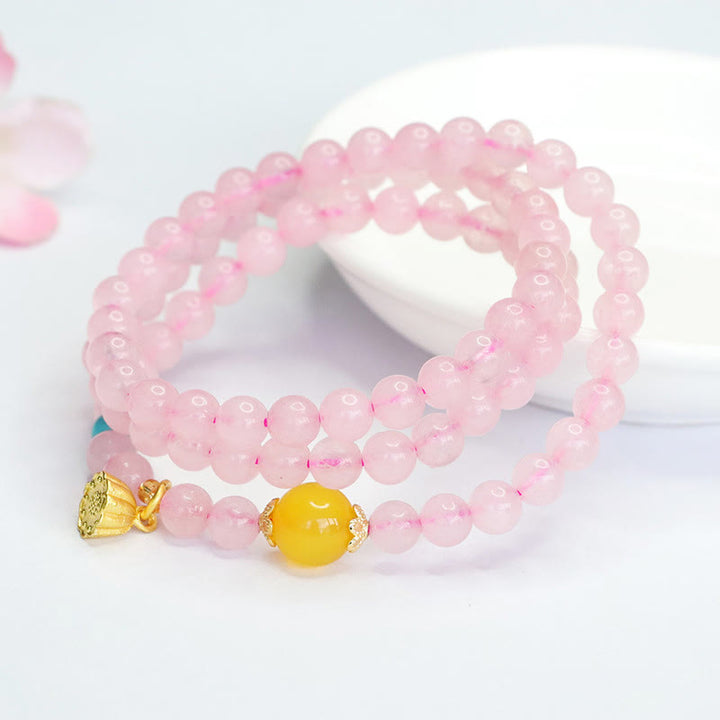 Pulsera de loto con cristales rosas y múltiples círculos de calcedonia amarilla y calidez de Buddha Stones