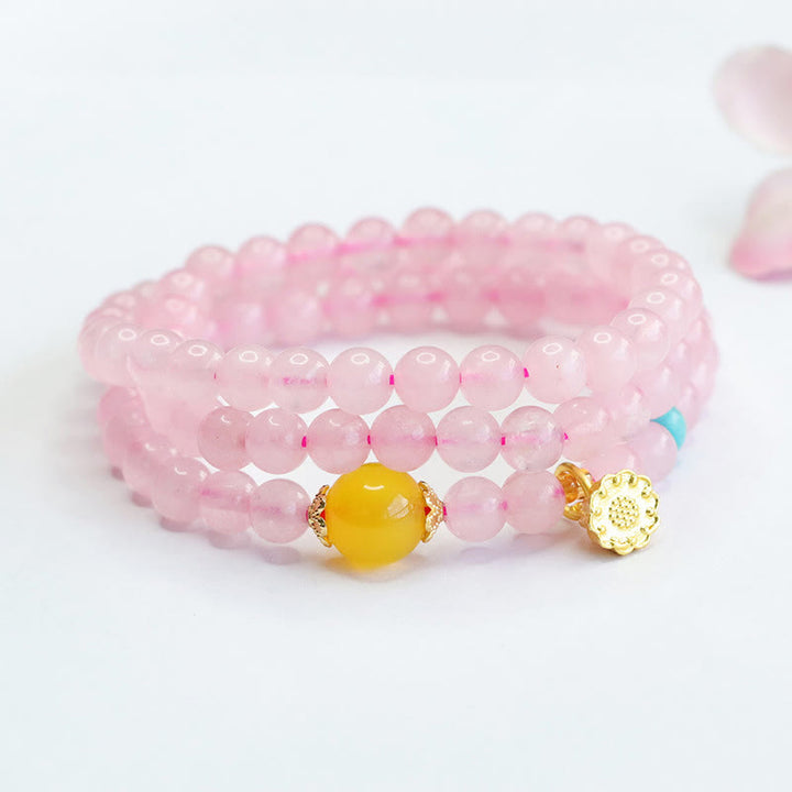 Pulsera de loto con cristales rosas y múltiples círculos de calcedonia amarilla y calidez de Buddha Stones
