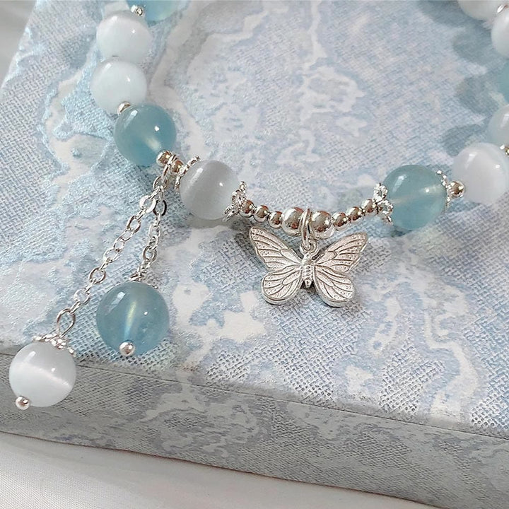 Pulsera de soporte con dije de mariposa y aguamarina ojo de gato con Buddha Stones