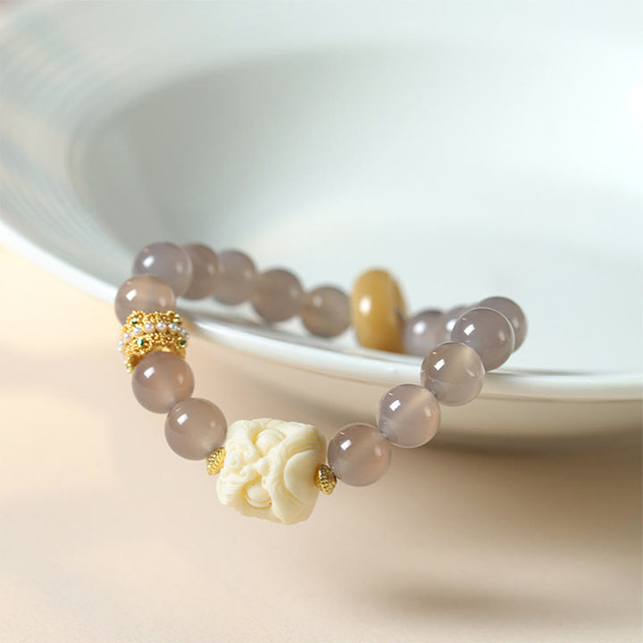 Pulsera de confianza con Buddha Stones, ámbar, ágata gris, marfil y fruta
