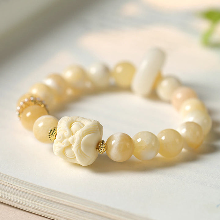 Pulsera de confianza con Buddha Stones, ámbar, ágata gris, marfil y fruta