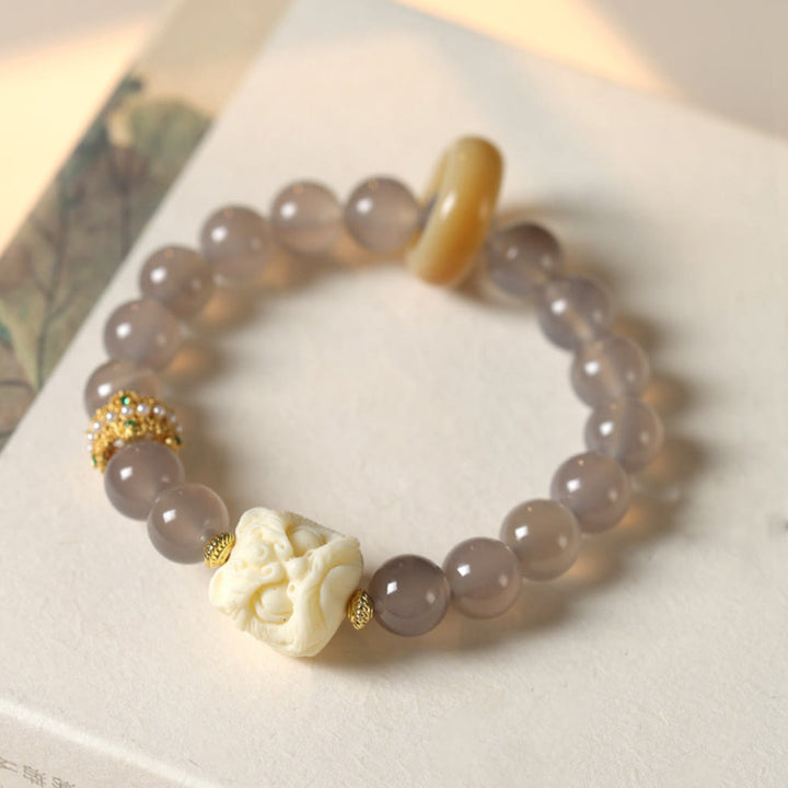 Pulsera de confianza con Buddha Stones, ámbar, ágata gris, marfil y fruta