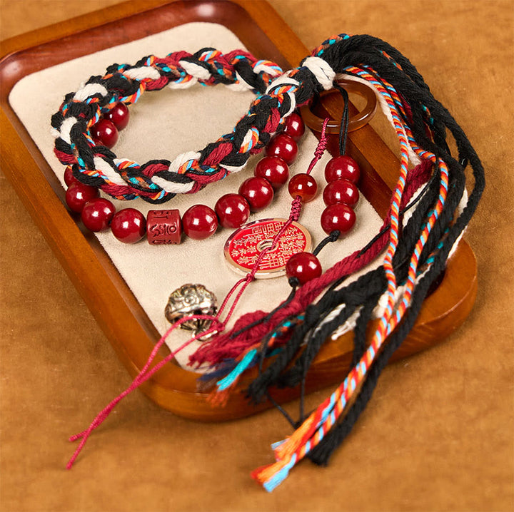 Pulsera de borlas de cuerda roja de doble capa con cinabrio y piedras de Buddha Stones tibetanas que gastan dinero